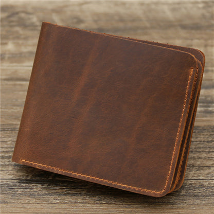 Brown leather wallet on wooden surface, stylish accessory at FashionRay