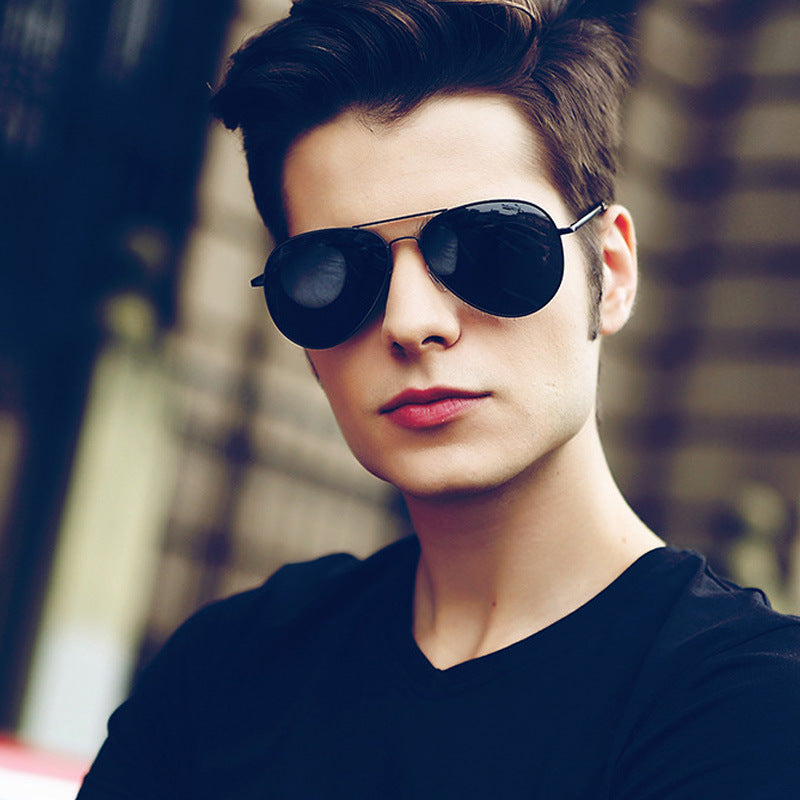 Stylish man with black aviator sunglasses and black shirt, fashion street style by FashionRay