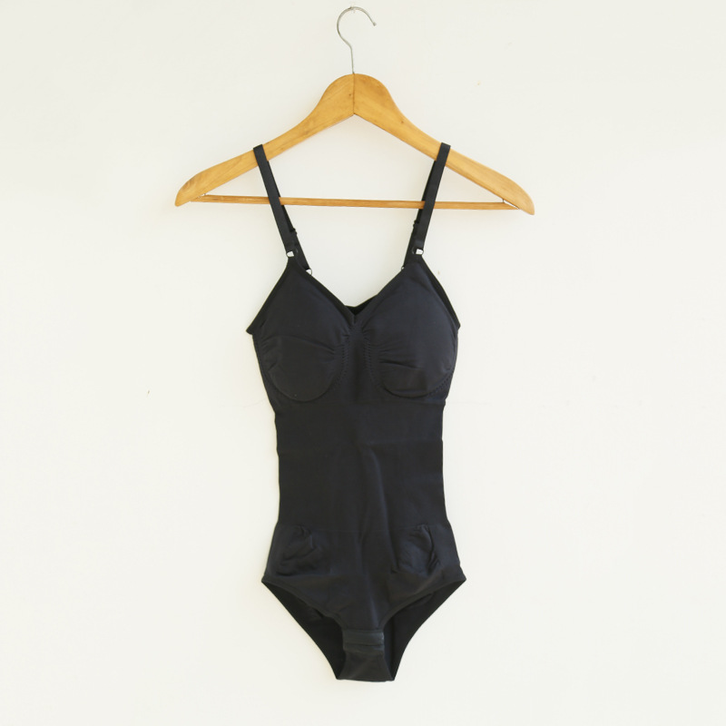 Black one-piece bodysuit with adjustable straps on wooden hanger, FashionRay trendy style