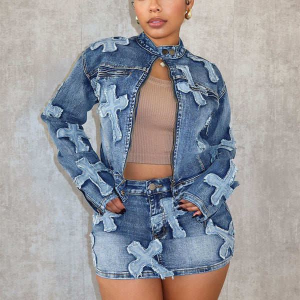 Woman wearing FashionRay denim jacket and skirt with bold cross patchwork, neutral crop top