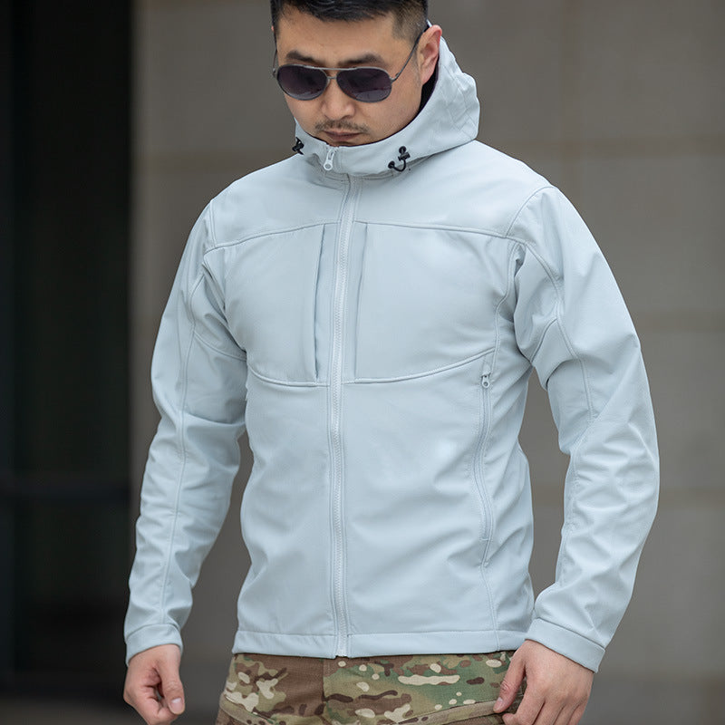 Man wearing a light gray hooded jacket and camouflage pants, fashion outerwear by FashionRay