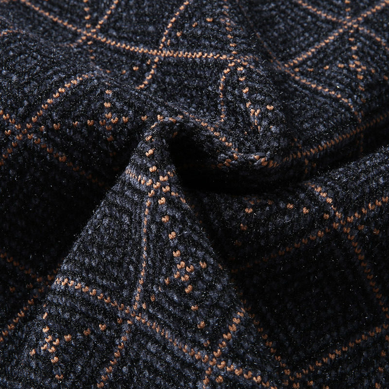 Close-up of textured navy blue fabric with orange plaid pattern, FashionRay trendy textile