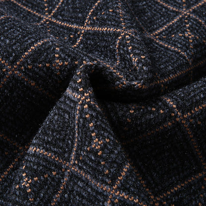 Close-up of textured navy blue fabric with orange plaid pattern, FashionRay trendy textile