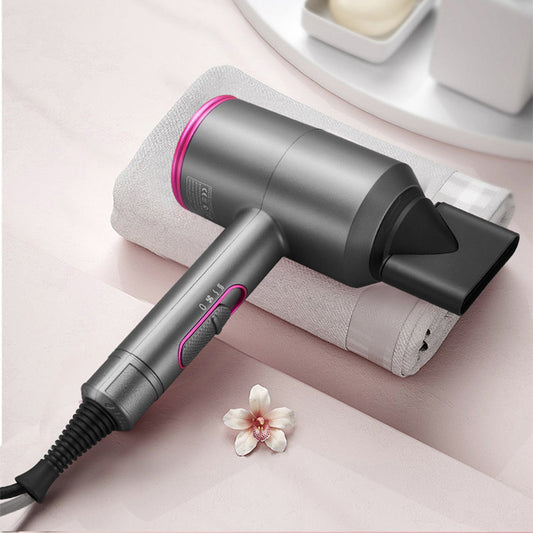 Modern gray and pink hair dryer on towel, stylish accessory at FashionRay, soft background