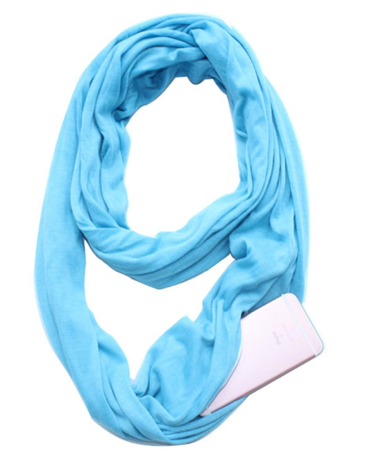 Light blue infinity scarf with hidden pocket, holding a smartphone, on white background