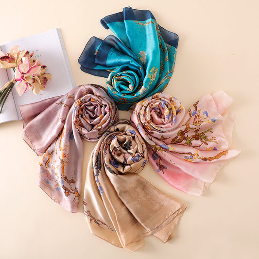 Floral silk scarves in blue, pink, beige, and purple from FashionRay on a neutral background