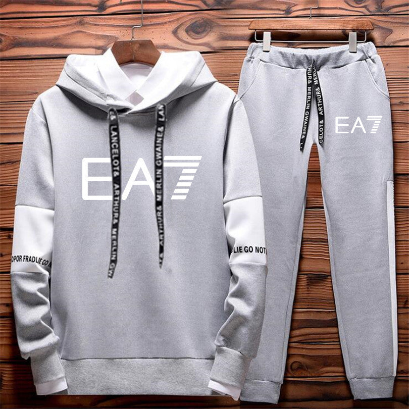 Light gray EA7 tracksuit set with hoodie and joggers, modern sporty design, FashionRay style
