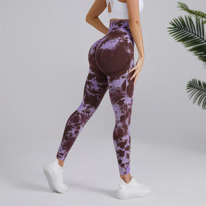 Woman in tie-dye purple and brown leggings and white sneakers, FashionRay activewear style