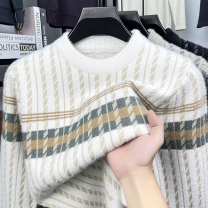 Hand holding soft plaid knit sweater with beige and gray stripes at FashionRay store
