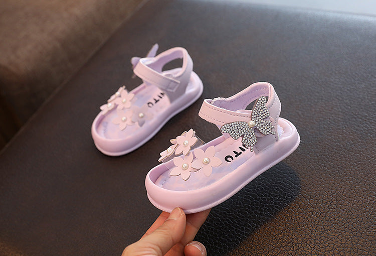Light purple toddler sandals with flower and butterfly decorations on FashionRay