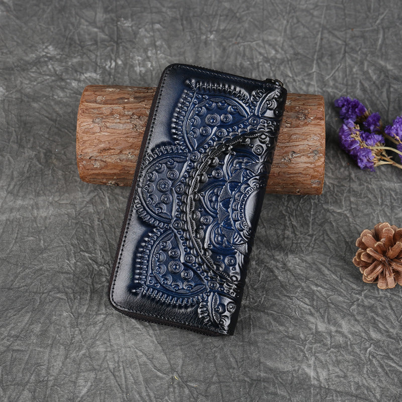 FashionRay embossed navy leather wallet with intricate pattern on rustic background