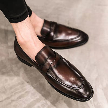 Men’s brown leather loafers on concrete floor, FashionRay elegant and comfortable footwear