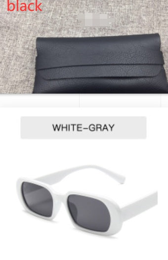 Black textured clutch purse and white-gray fashion sunglasses on display at FashionRay.