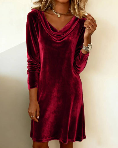 Woman wearing a long-sleeve velvet burgundy dress, stylish FashionRay casual outfit