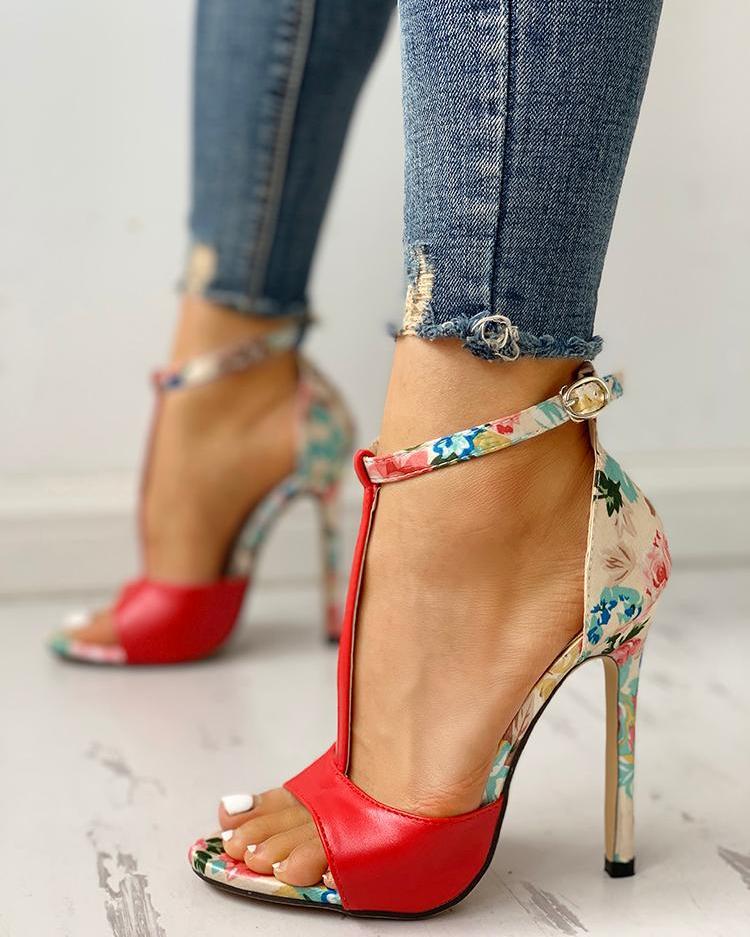Red floral high heel sandals with ankle strap, paired with distressed skinny jeans, FashionRay style