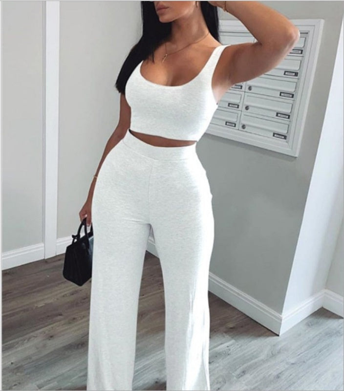 Woman wearing a white crop top and wide-leg pants set, trendy fashion at FashionRay