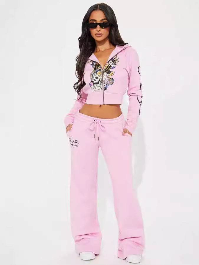 Woman in pink skull graphic hoodie and sweatpants set with sunglasses, FashionRay style