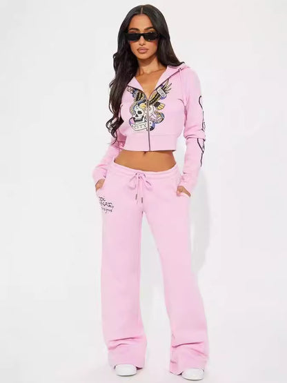 Woman in pink skull graphic hoodie and sweatpants set with sunglasses, FashionRay style