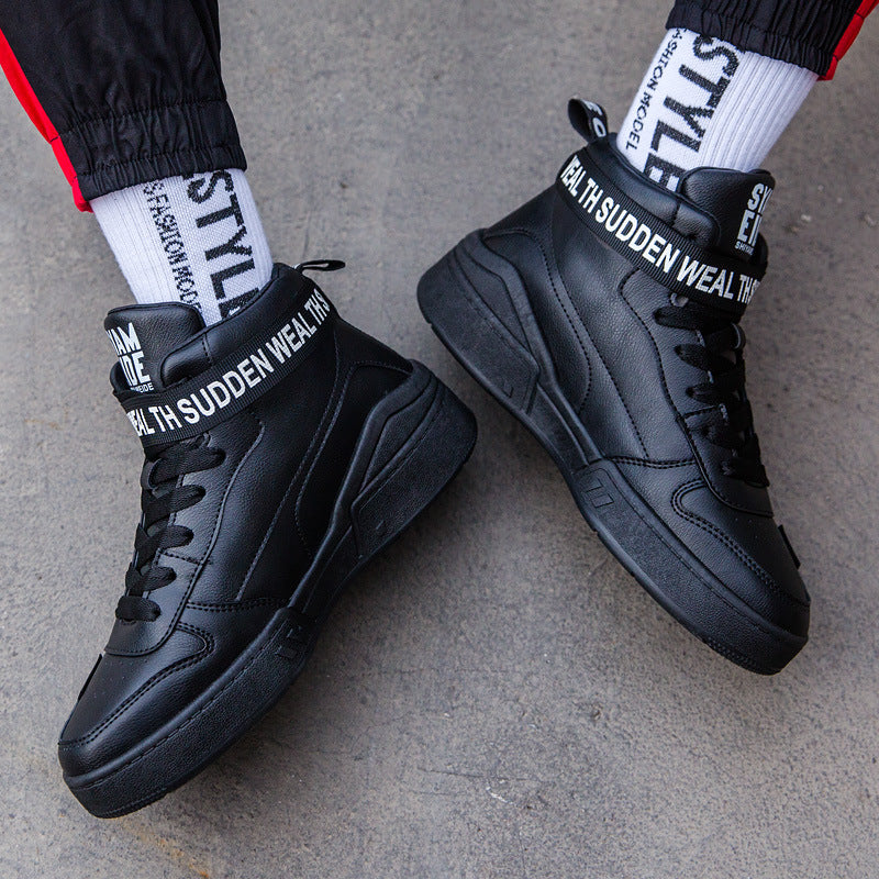 Black high-top sneakers with bold logo accents, showcased with white socks from FashionRay