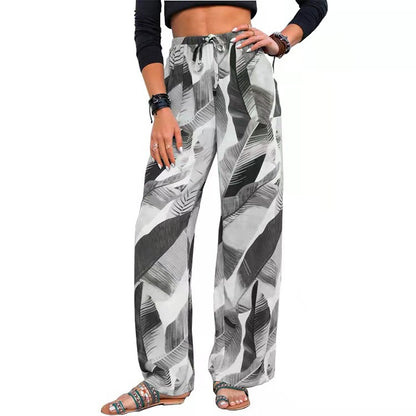 Woman wearing FashionRay black and white leaf print wide leg pants and crop top