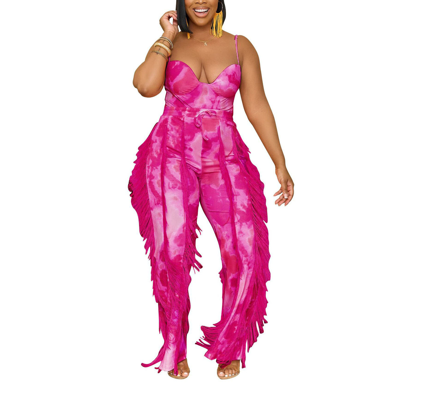 Woman in vibrant pink tie-dye fringe jumpsuit, trendy fashion style from FashionRay