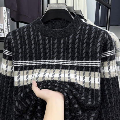 Hand touching soft black and gray striped sweater on hanger, FashionRay comfortable knitwear