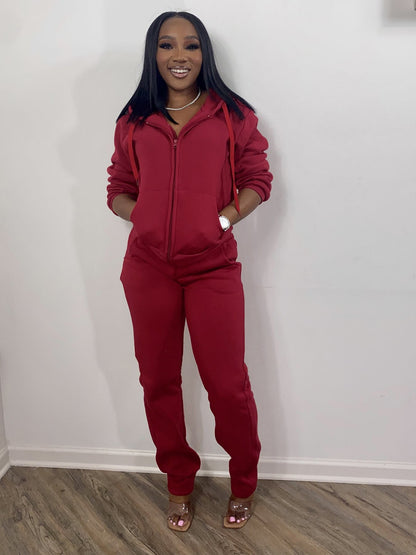 Woman in red zip-up tracksuit and clear heels, FashionRay trendy loungewear style