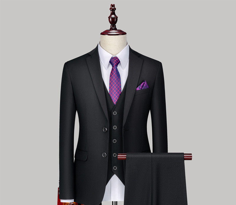 Black three-piece suit with purple tie and pocket square on mannequin, FashionRay menswear