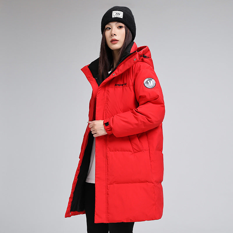 Woman in red puffer jacket and black beanie, FashionRay trendy winter outerwear