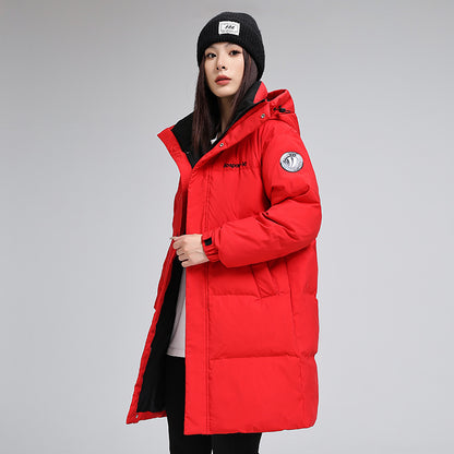 Woman in red puffer jacket and black beanie, FashionRay trendy winter outerwear