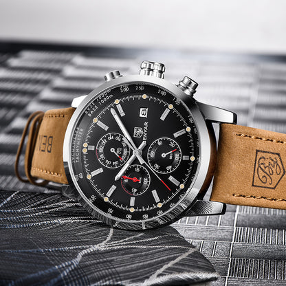 Luxury men's chronograph watch with black dial and tan leather strap on textured surface, FashionRay