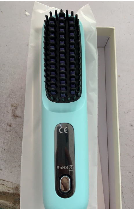 Mint green electric hair straightening brush in box, modern beauty tool at FashionRay