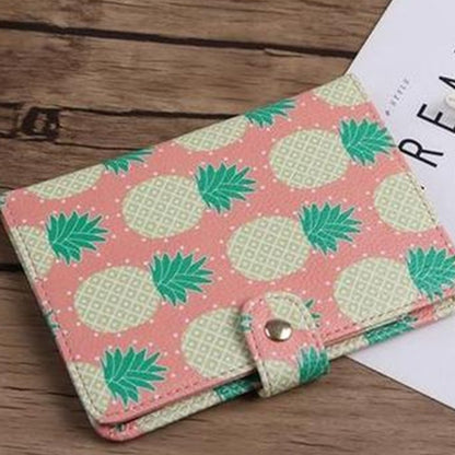 Colorful pineapple print wallet on wood table, trendy accessory at FashionRay