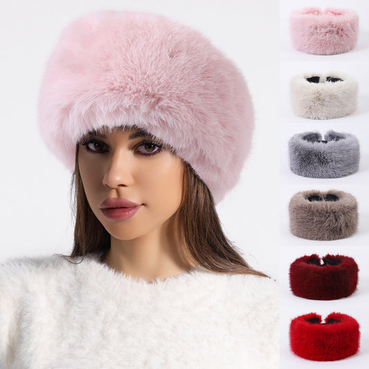 Woman wearing a pink faux fur hat and sweater, with five fur hat color options from FashionRay