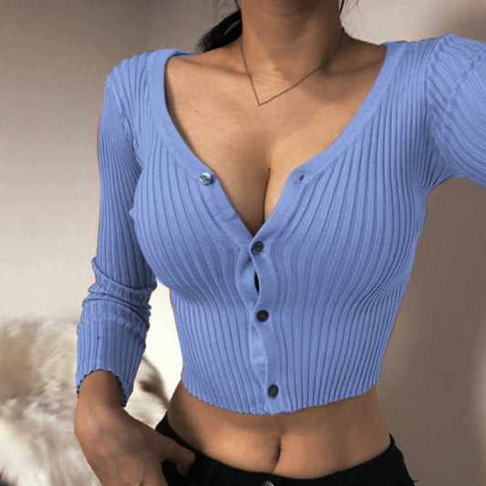 Woman wearing a trendy ribbed blue button-up crop top from FashionRay