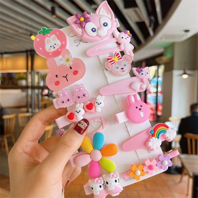 Hand holding a pack of cute colorful hair clips with animal and flower designs at a trendy cafe.