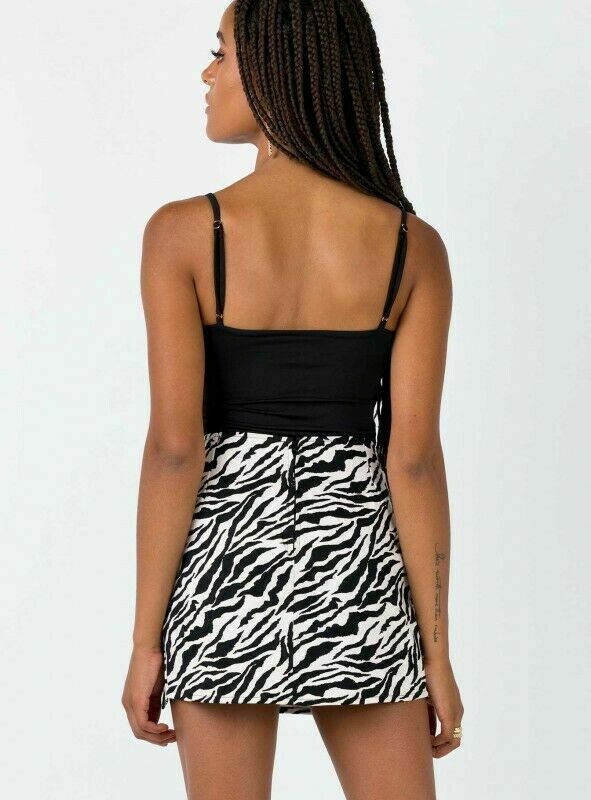 Woman wearing black tank top and zebra print mini skirt, FashionRay trendy style