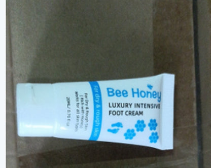 Bee Honey luxury intensive foot cream tube for dry skin on a brown surface at FashionRay