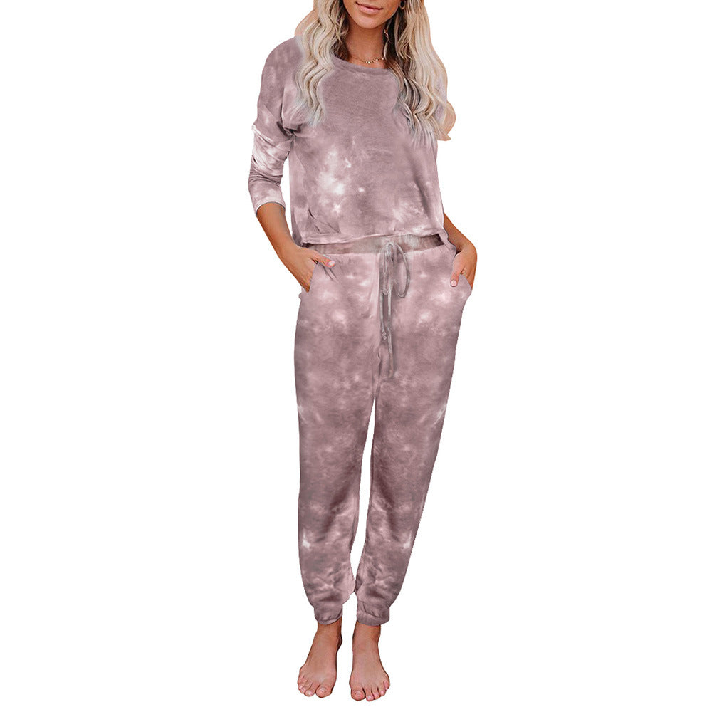 Woman wearing mauve tie-dye lounge set with long sleeves and drawstring pants, FashionRay