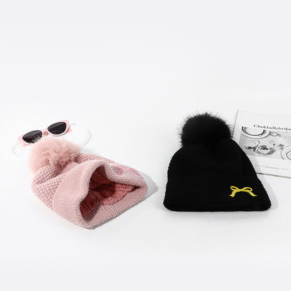 FashionRay cozy knit winter hats in pink and black with pom-poms, stylish sunglasses, magazine.