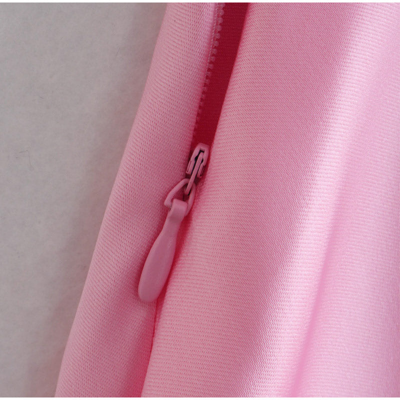 Close-up of a pink zipper on a soft pink fabric, FashionRay trendy outfit detail
