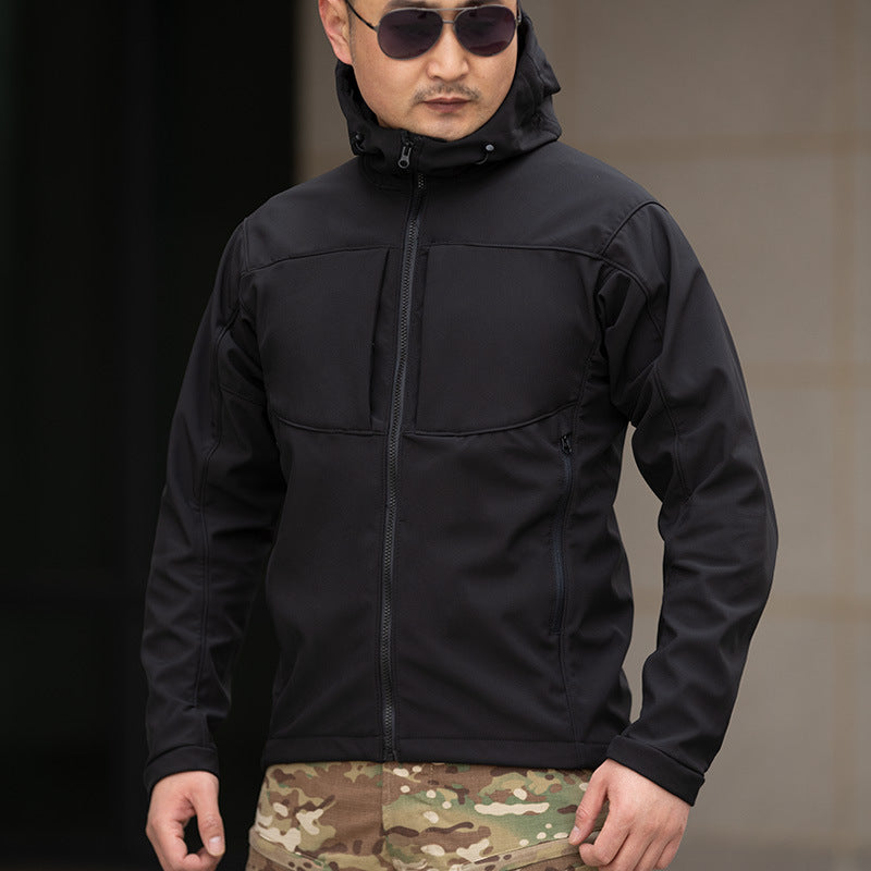 Man in black hooded jacket and camouflage pants, FashionRay outdoor urban style