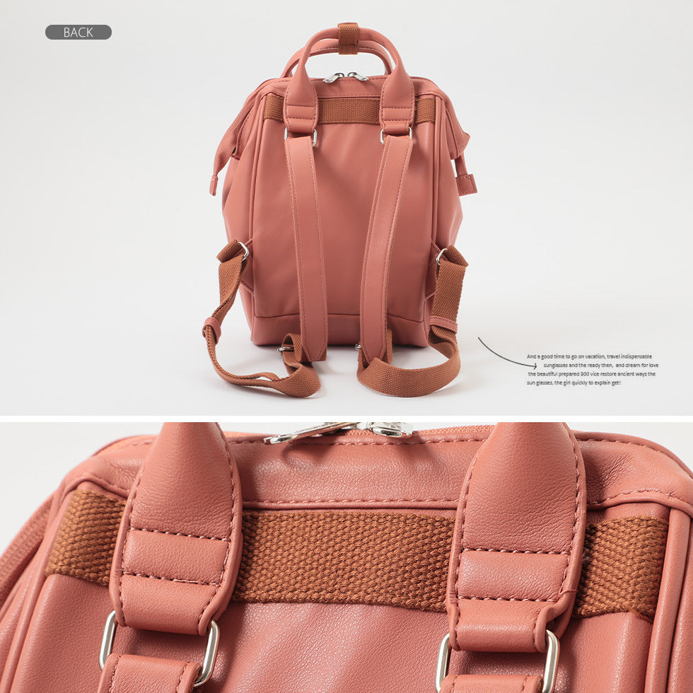 Back view of a stylish pink leather backpack with adjustable straps, showcased at FashionRay.