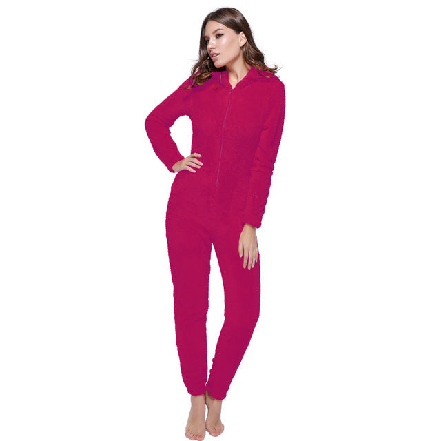 Woman wearing a bright pink fleece hooded jumpsuit, FashionRay cozy loungewear style