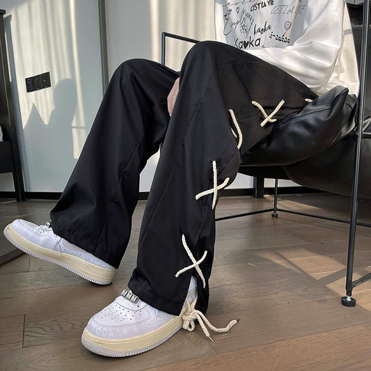Trendy black pants with rope details and white sneakers, FashionRay modern streetwear style