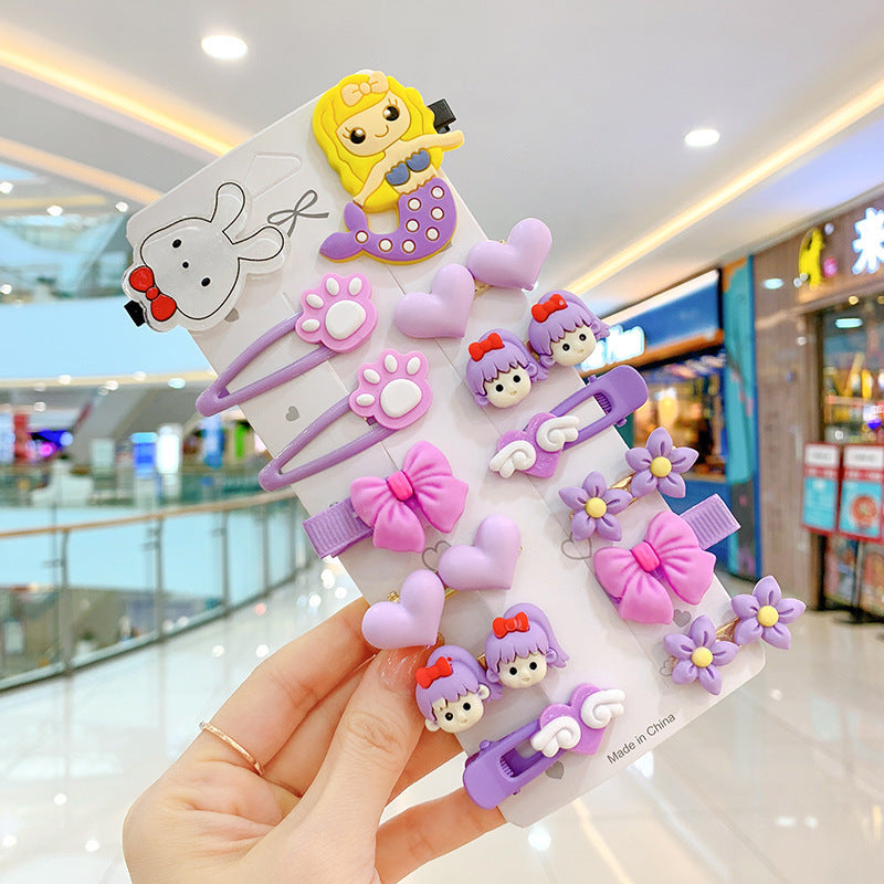 Cute pastel hair clips with cartoon designs, hearts, bows, and flowers at FashionRay mall.