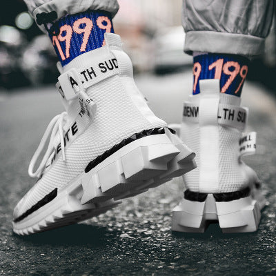 Trendy white fashion sneakers with chunky soles and bold socks, street style by FashionRay