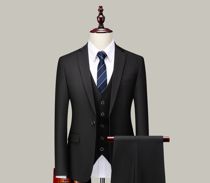 Men's black three-piece suit with striped tie on mannequin, FashionRay formal wear