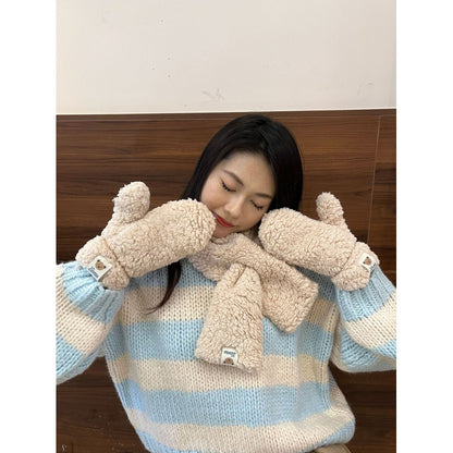 Woman in cozy striped sweater with fluffy beige mittens and scarf, FashionRay winter style