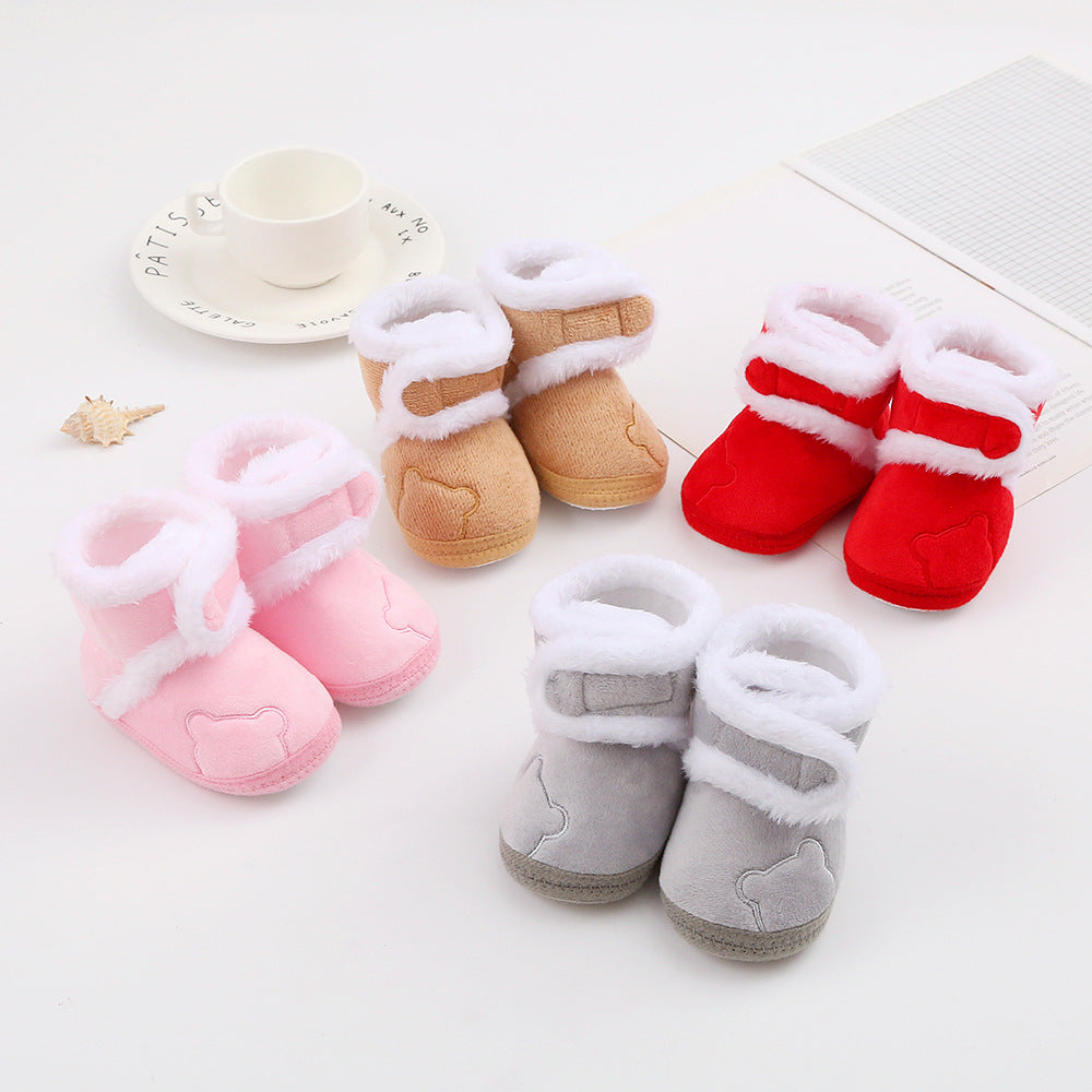 FashionRay soft baby booties in pink, tan, red, and gray with plush white trim on display